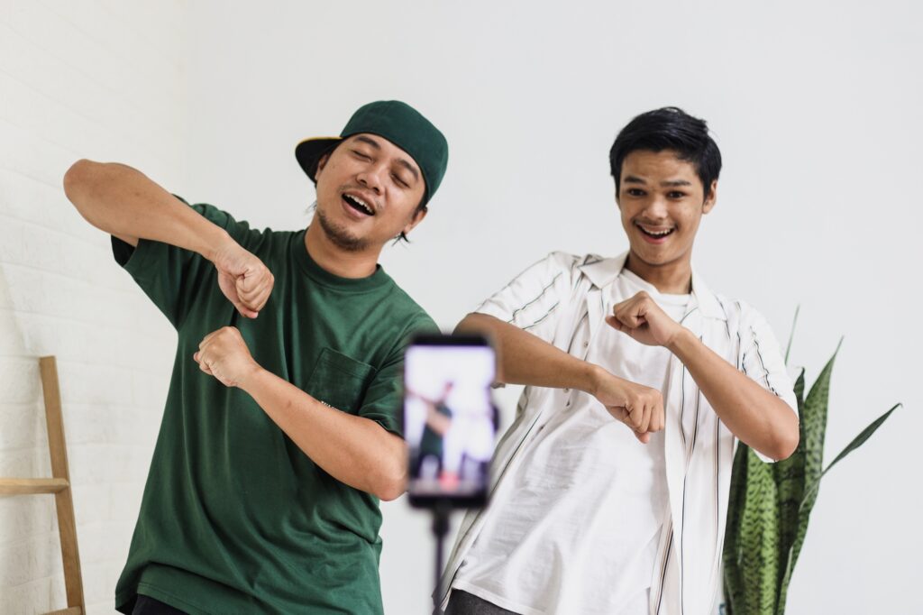 Friends dancing tiktok, recording by smartphone